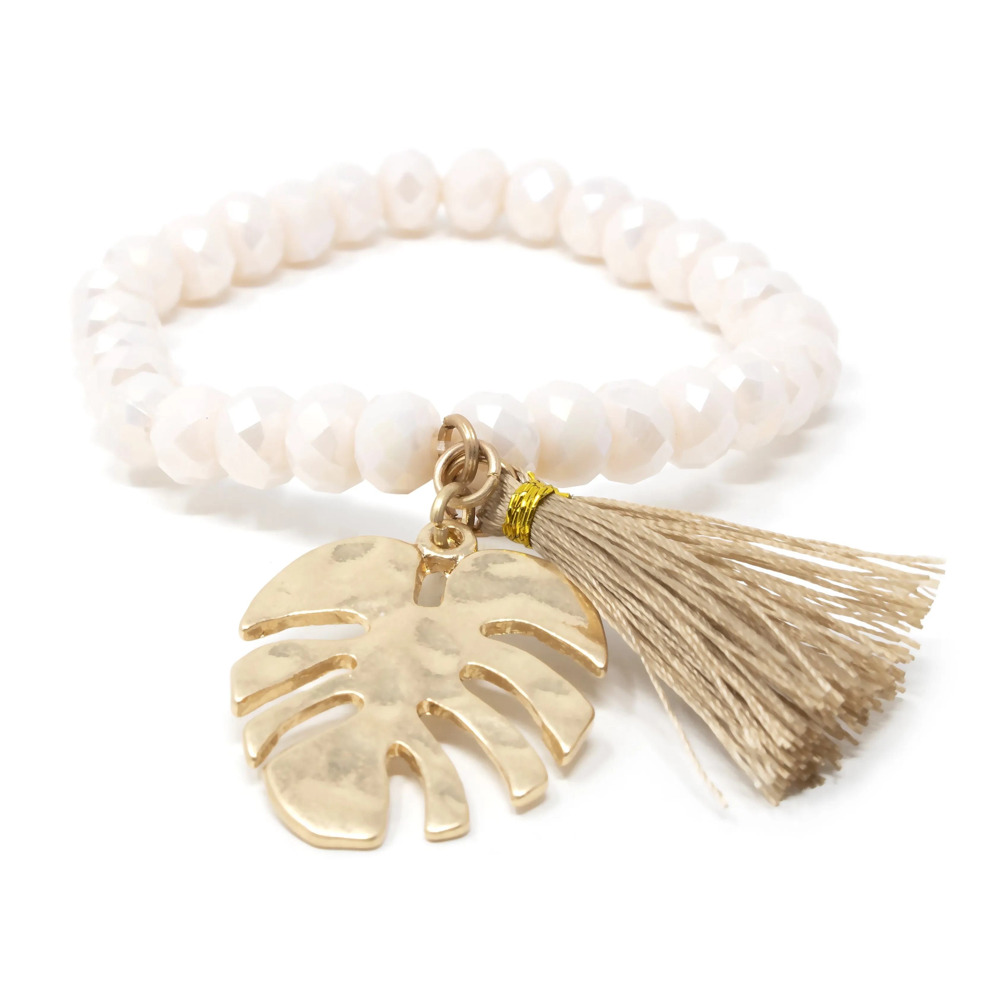 Gold Tone Set of Two Stretch Bracelets With Tassel and Leaf Charm Cream